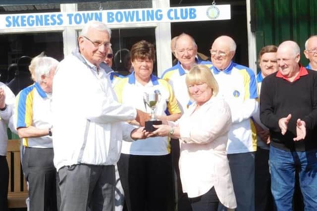 Mike Moore is pictured receiving the Barry Dennis Cup from Barrys daughter Denise.
