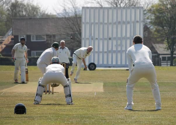 Sean Wooley opens Caistor's defence of their Premier title, bowling from the Kelsey Road End. Picture: Wes Allison EMN-190423-100859002