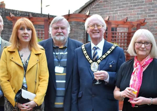 Mayor of North Lincolnshire John Briggsand artist Lynda Houghton are pictured with members of the Lindsey Lodge Hospice Senior Management Team and Board of Trustees at the Art Exhibition and Sale. EMN-190425-105750001