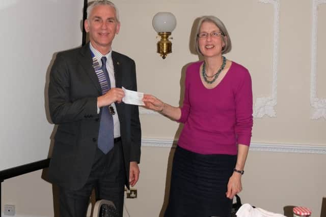 Sue Mumford with Lion President Phil Walter. EMN-190425-163830001