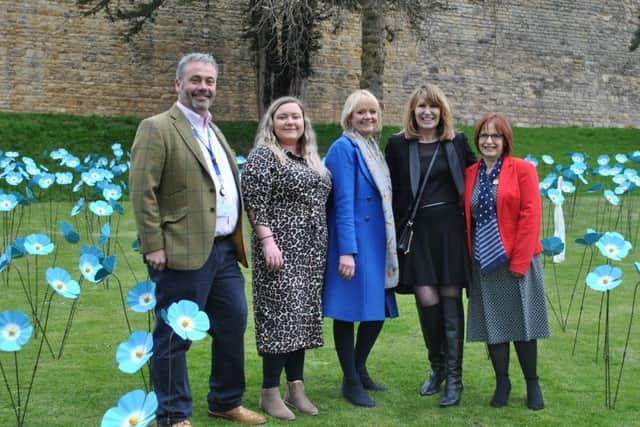 Representatives from St Barnabas Hospice and Tanglewood Care Homes amongst the Forget Me Not display.