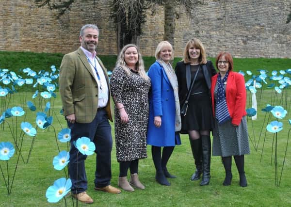 Representatives from St Barnabas Hospice and Tanglewood Care Homes amongst the Forget Me Not display.