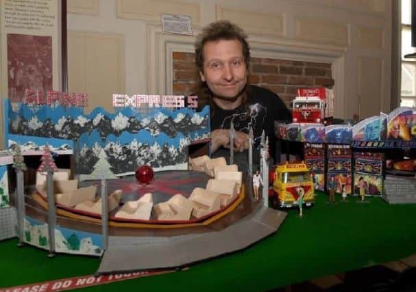 Chris Hudson with his model. EMN-190429-115918001