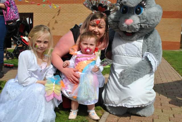 Toray Pines Manager Katie More with her daughters Lola (left), Isla Mai (centre) and the Tanglewood Easter bunny EMN-190430-101912001
