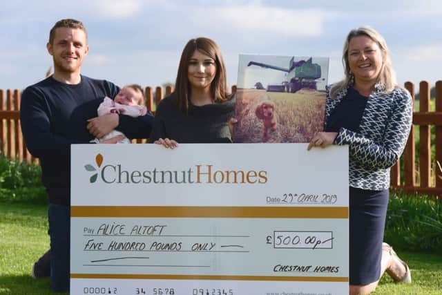 Competition winner Alice Altoft receives her £500 prize from Chestnut Homes.
