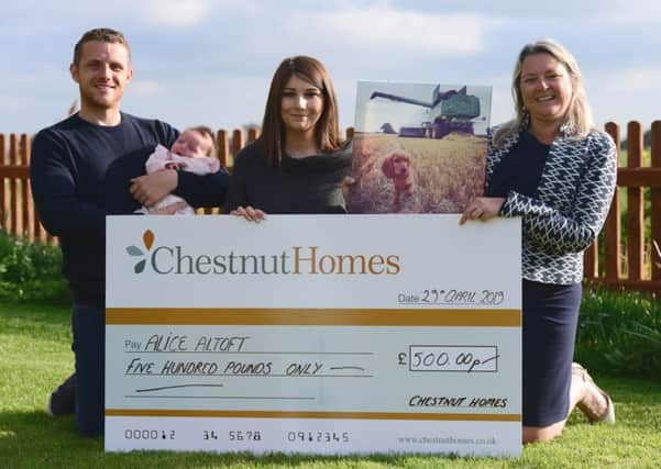 Competition winner Alice Altoft receives her £500 prize from Chestnut Homes.