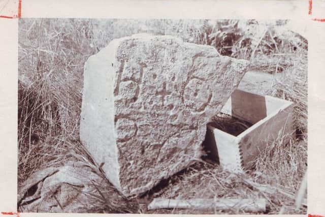 The stone was discovered at the islands Joudreys Cove by locals some time ago. Noticing strange carvings on it, they blew it up, believing the treasure lay buried beneath. Treasure hunter Gilbert Hedden recovered fragments of it in 1936, one of which had Rune symbols similar to the letters H+O. It is not known what the original carving said when the huge rock was in one piece.