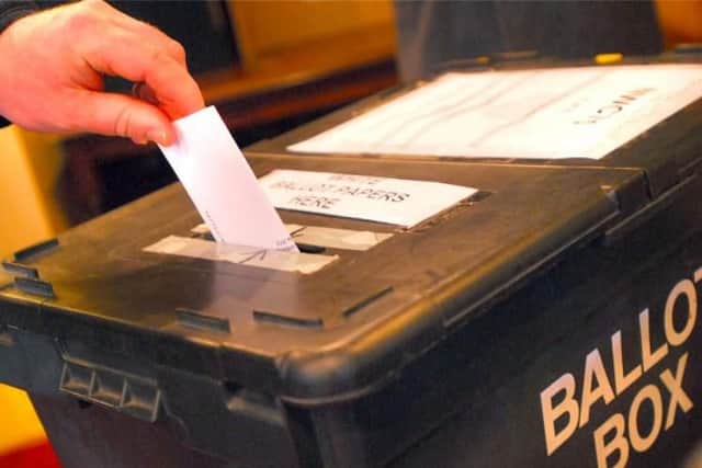 People go to the polls in Boston on Thursday