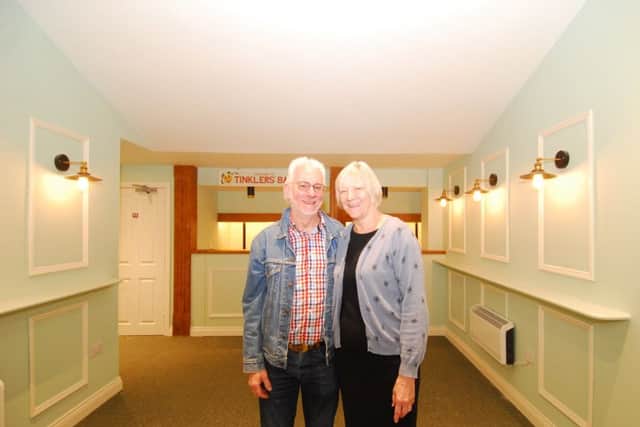 Project leaders Garry Goodge and Christine Malkin proudly survey the completed revamp of Sleaford Playhouse foyer area. EMN-190705-123537001
