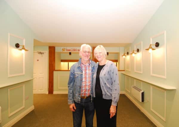 Project leaders Garry Goodge and Christine Malkin proudly survey the completed revamp of Sleaford Playhouse foyer area. EMN-190705-123537001