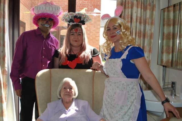 Eveline Annabel is pictured with staff at Toray Pines, in Coningsby, to celebrate her 104th birthday.
