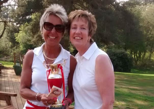 Ladies' Captain Mel Gregory presents the St George's Fantasy prize to Lulu Wood.