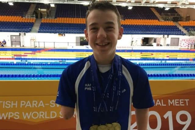 Harvey celebrates his medal haul.