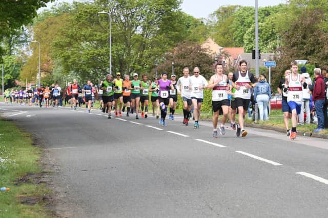 Sleaford Half Marathon and Fun Run. Runners on Boston Road, Sleaford. EMN-190605-103807001