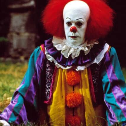 Stephen King's film, It. Now two terrified boys have been chased by a gang of eight clowns on Leasingham playing field. ABCDE PPP-161010-120344001