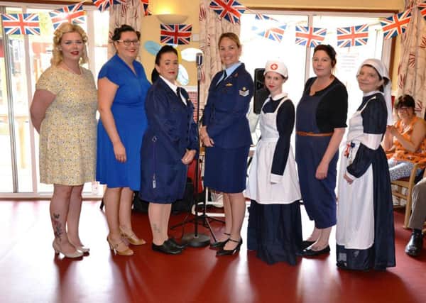 Ashdene Care Home staff and singers in costume for their 1940s themed event for residents. EMN-191005-165240001