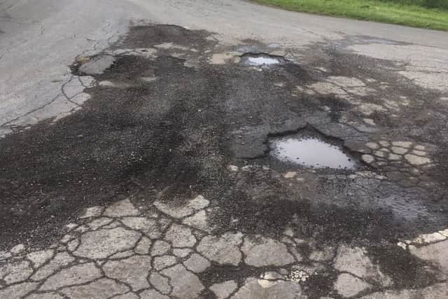 Craig Wood has complained that potholes are being ignored in Burton Pedwardine, but county councillor Martin Hill says they have to prioritise spending. EMN-190513-172605001