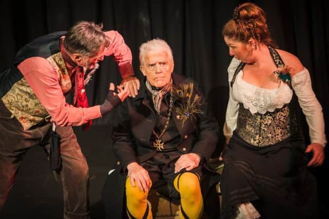 Very fetching in yellow stockings and crossed garters. Paul Sproxton as Malvolio with his tormentors Tony Gordon as Sir Toby Belch and Caroline Johnson as Maria. EMN-191005-110645001