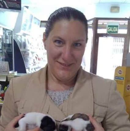 Jasmine with two puppies which were found dumped in a rubbish bin.