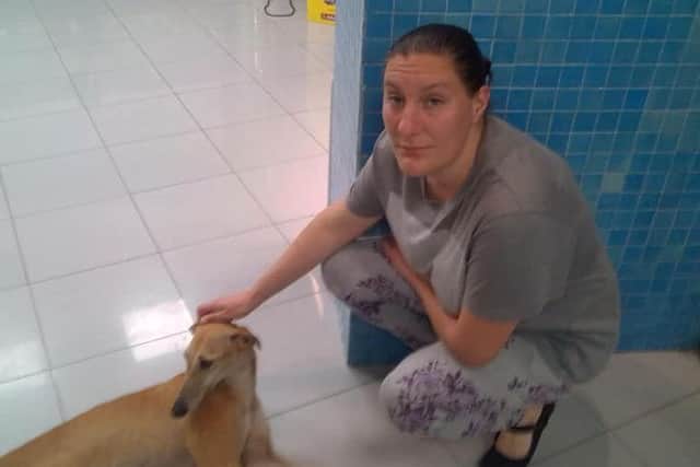 Former Wainfleet St Mary woman Jasmine Carter with one of the rescue dogs which was found with a broken leg.