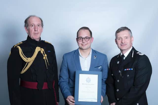 Adam receives his bravery certificate
