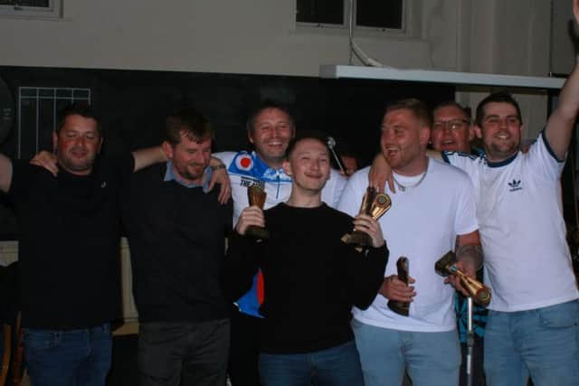 Web Signs Division One winners Seaview Next Tuesday celebrate.