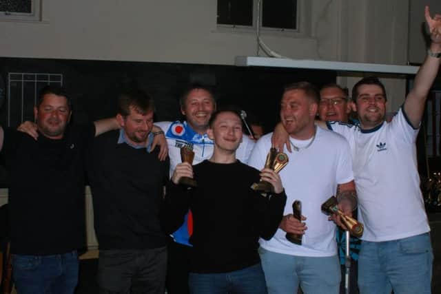 Web Signs Division One winners Seaview Next Tuesday celebrate.
