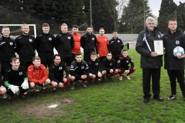 Brigg Town CIC are presented with their Balcan Lighting Supplies Lincolnshire League team of the month award before their Challenge Cup Final at The Hawthorns on Friday night. League president Neil Watson is pictured presenting the certificate and match ball to manager Lee Thompson. EMN-190513-104512002