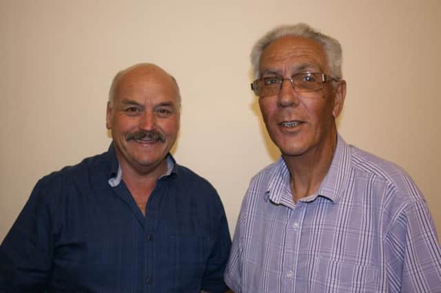 Martin Briggs (right) hands over the chairmanship to Mike Green
