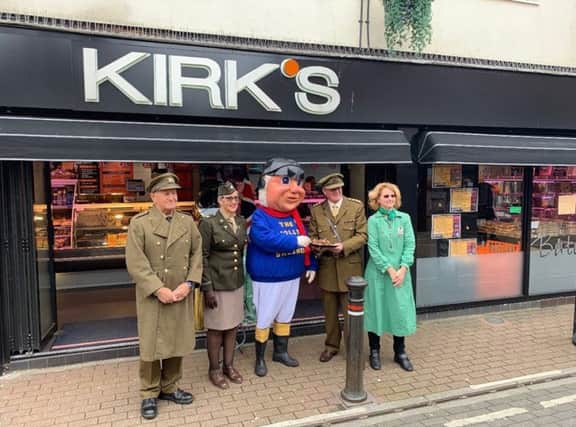 Kirk's Butchers in Skegness handing over the wartime  recipe sausages they have made for the  1940's event at The Village Church Farm in Skegness this weekend. The Jolly Fisherman also popped along to give them the thumbs up. ANL-190513-073914001