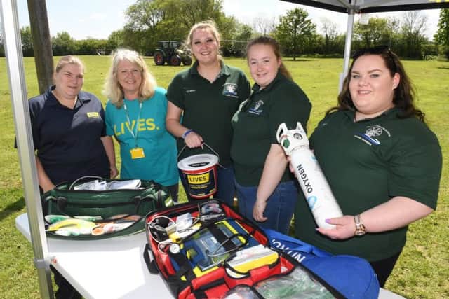 Heckington and Sleaford Young Farmers tractor run and family fun day at Screddington village hall, for LIVES. L-R Becky Willford and Carol Harper of LIVES, with Young Farmers Gracie Wood, Beth Appleyard and Isabel Wood. EMN-190513-095618001