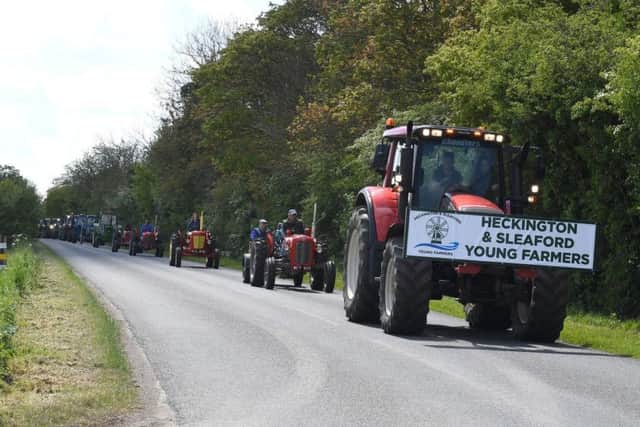 Heckington and Sleaford Young Farmers tractor run and family fun day at Screddington village hall, for LIVES. Tractors on Mareham Lane heading back to Screddington village hall. EMN-190513-095644001