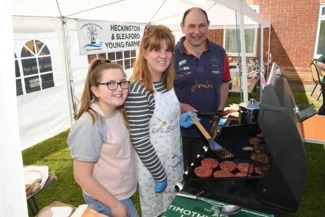 Heckington and Sleaford Young Farmers tractor run and family fun day at Screddington village hall, for LIVES. Stave and Nichola Mason with Ruby Mason 12 on the BBQ. EMN-190513-095631001