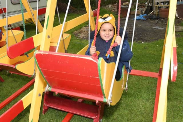 Family Fun Day at Village Church Farm, Skegness. Ellie-Mae Ryan 5 of Skegness on a swing boat.