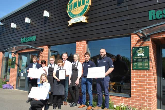 From left -: Eve Bowler and John Maddison from Sleaford Dementia Support, Adrian and Rachel Tweedale co-directors at The Elite Fish & Chip Company along with staff members Tracey Donoghue and Ella Good, Daniel Cooper and Chris Nisbet from the RNLI and Lucy Slonecki from the RAF Association with the ?32,128.92 donation. EMN-190521-090320001