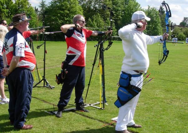 Louth clubmates Stuart and Pete on the shooting line watched by spotter Rick Smith EMN-190516-120839002