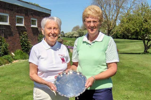 Pictured is Lady Captain Pam Clare handing over the trophy to Chris Sherriff.