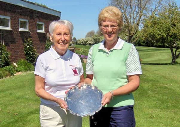 Pictured is Lady Captain Pam Clare handing over the trophy to Chris Sherriff.