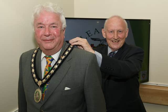 Sleaford Town Council elect new mayor Coun Adrian Snookes, receiving his chain of office from outgoing mayor Grenville Jackson. EMN-190516-132934001