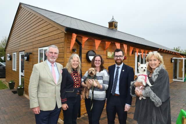 Jerry Green Rescue Centre opens new centre. L-R Trustees of The Pawprint, John and Victoria Taylor who opened the building, Lynn Hewison, Paul McCartan and Jayne Chudley - trustees of Jerry Green. Pictured with dogs Tigger and Narla. EMN-190521-094647005