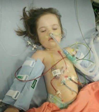 Evey Robinson after undergoing one of her heart operations. EMN-190521-101059001
