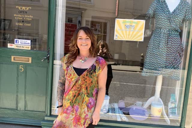 Julie Clark outside Thrifty's because charity starts at home. EMN-190520-143106001