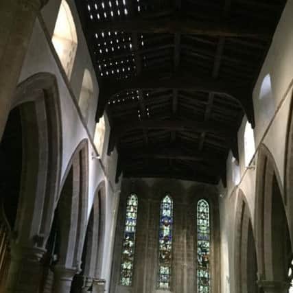 The interior of the Bicker church showing holes in the roof where the lead was removed by thieves.