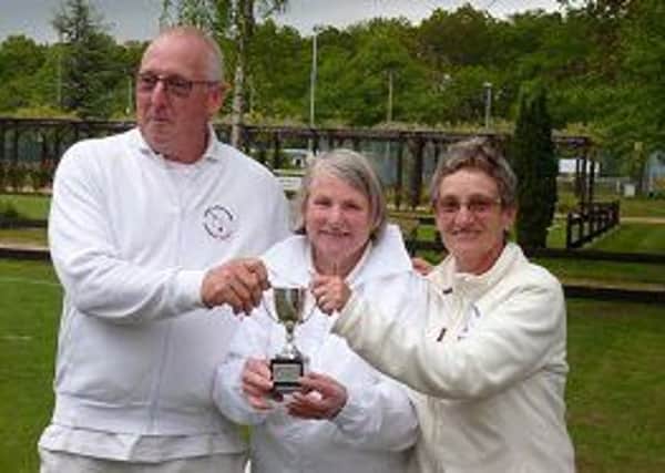 Paul Durkin and Jane Tewson receive the Lincoln Cup doubles trophy from Pauline Donner, chairperson of Woodhall Spa Croquet Club.