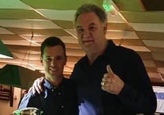 That¹s my boy! Snooker League President Del Hill presents the Town championship trophy to son Tom.