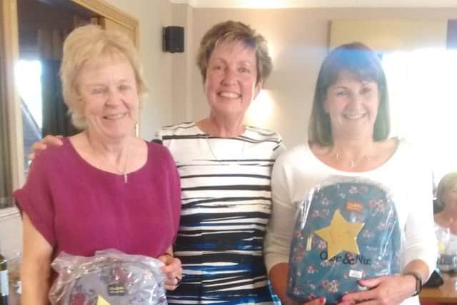 Ladies captain Mel Gregory is flanked by away day winners Bridget Holmes and Judy Phillips EMN-190527-100642002