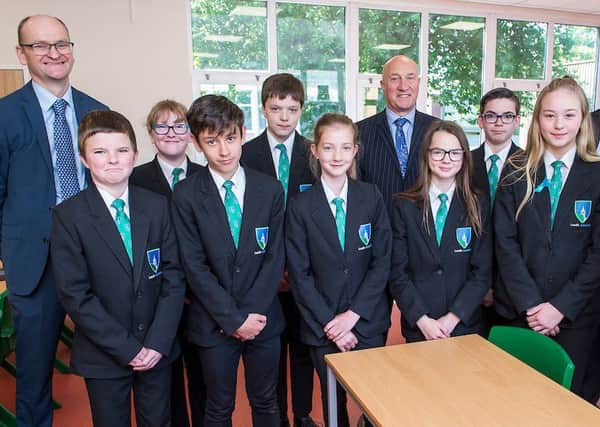 Year 7 Students at Louth Academy Lower Campus have settled in well to their new classrooms. They are pictured in one of the new Science Labs. (Left to right) Martin Brown (Executive Principal, Louth Academy) Ben Weston-Tottam, Molly Clements, Elliott Barton, Ellis Harkness, Kira Chamberlain, David Hampson  OBE (TMAT Chief Executive), Paige Harriman, James Cohen, Isabelle Mitchell,