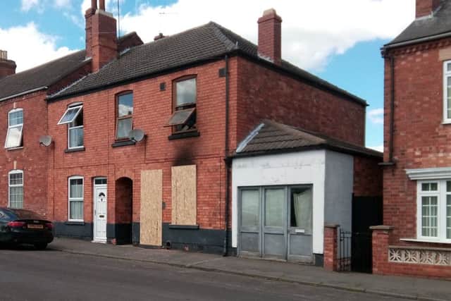 Boarded up. Tim Sampson's fire damaged home in Queen Street, Sleaford. EMN-190524-175313001