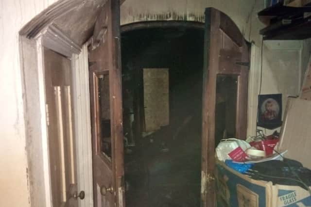 The charred doors to the living room which prevented the fire spreading to overtake the whole house in Queen Street, Sleaford. EMN-190524-175247001