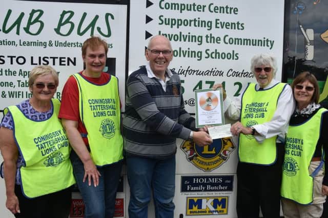Coningsby & Tattershall Lions presented a cheque for ?500 to County Linx Radio towards their bus repairs EMN-190306-201436001
